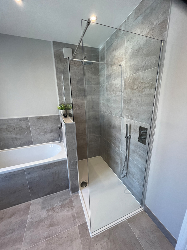 Germain porcelain floor tiles with large shower and fitted bath.